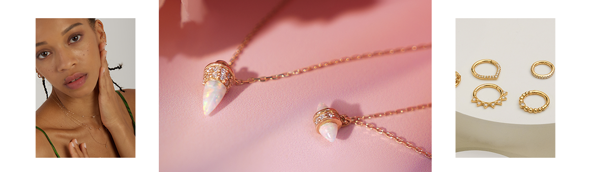 A bullet-shaped opal and lab-grown diamond necklace glistening in sunlight against a pink background, embodying a boho chic style.