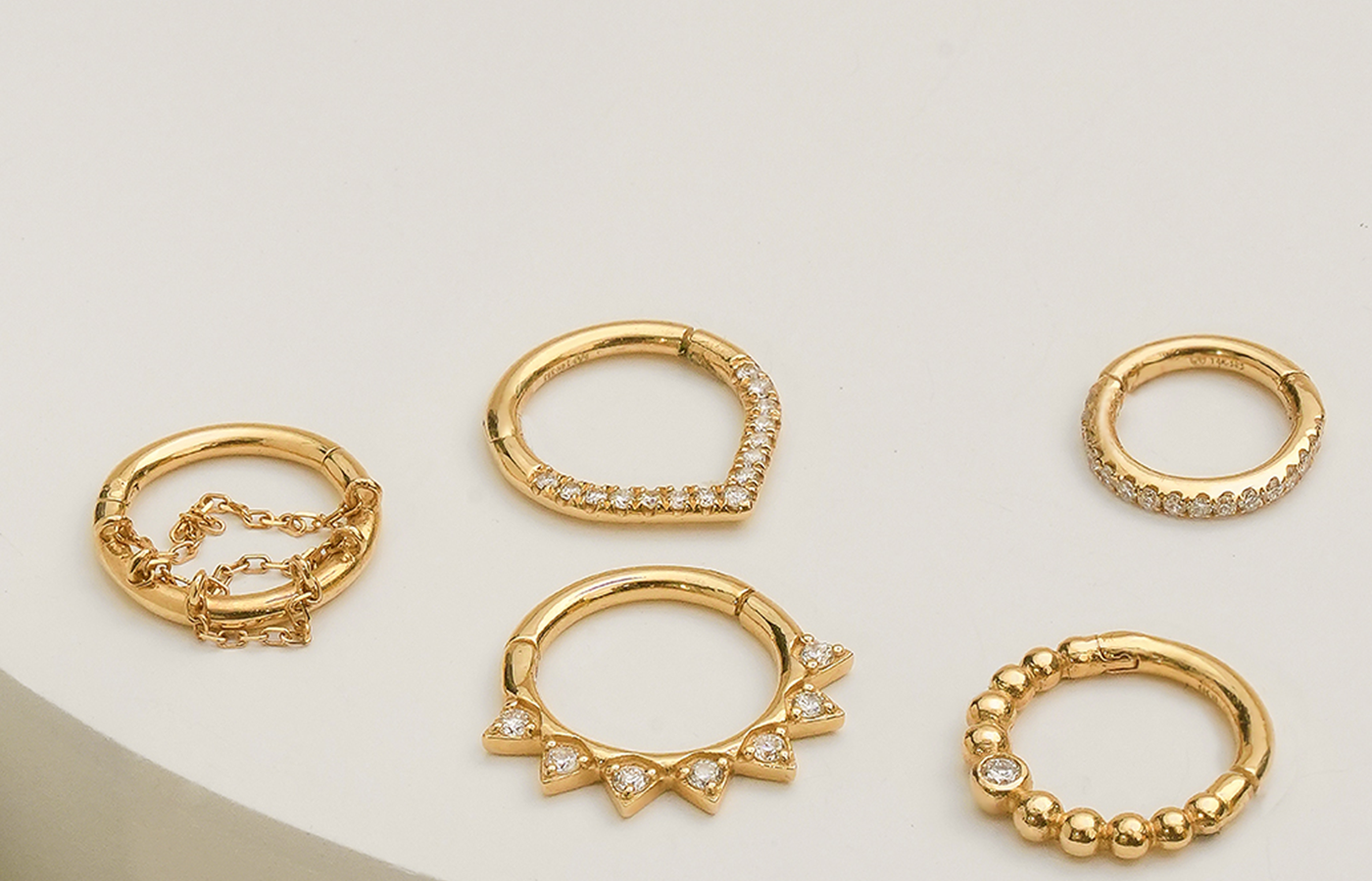 Stunning 14k gold and diamond seamless clicker hoops in various designs